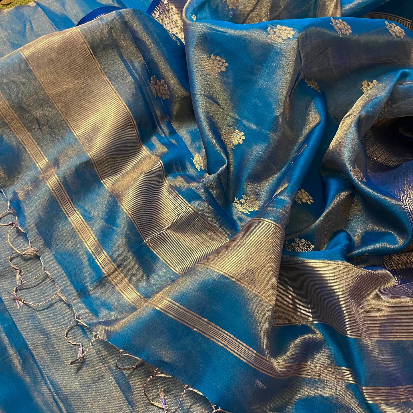 Peacock blue maheshwari tissue silk saree with flower motifs all over