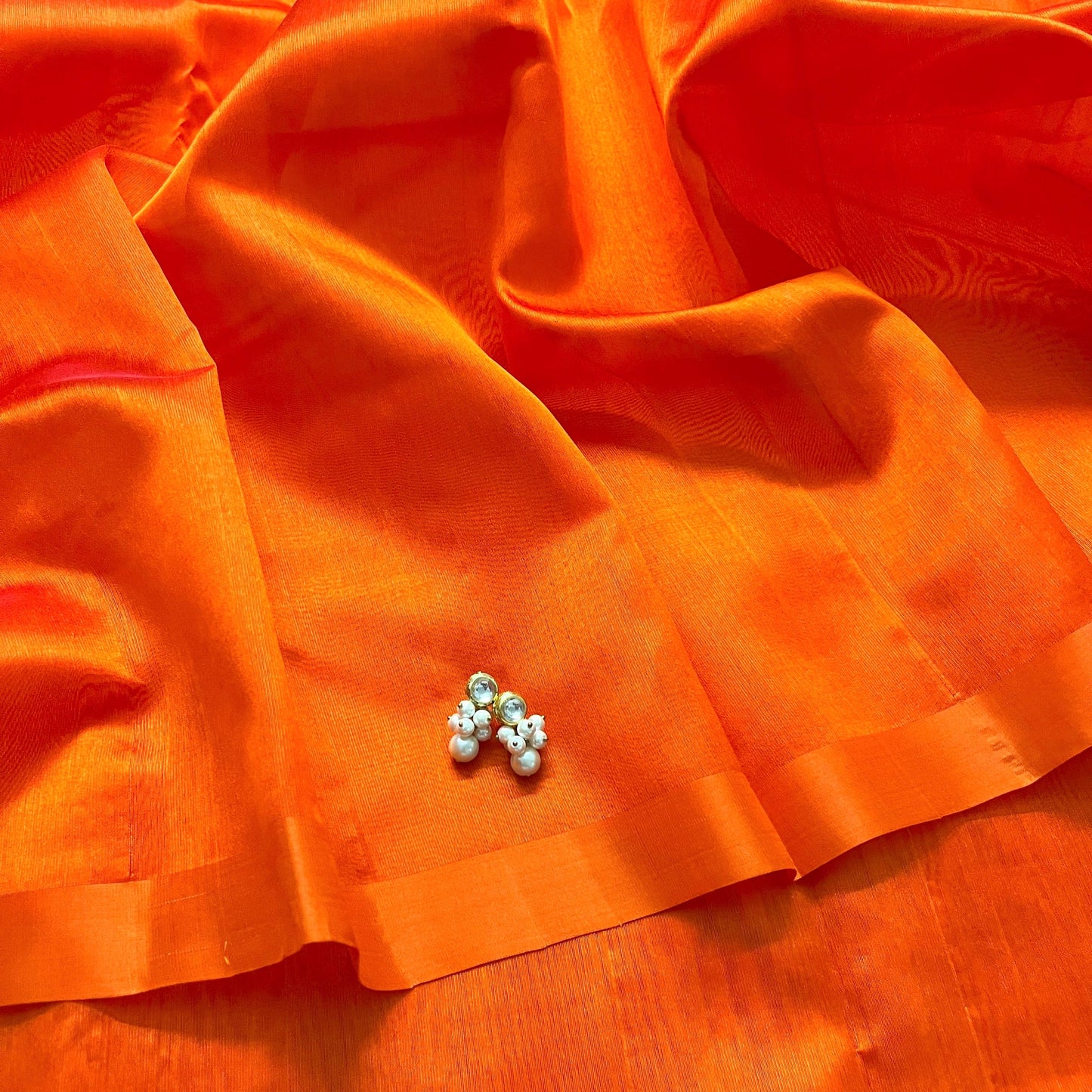 Sunset orange chanderi silk saree with silk border