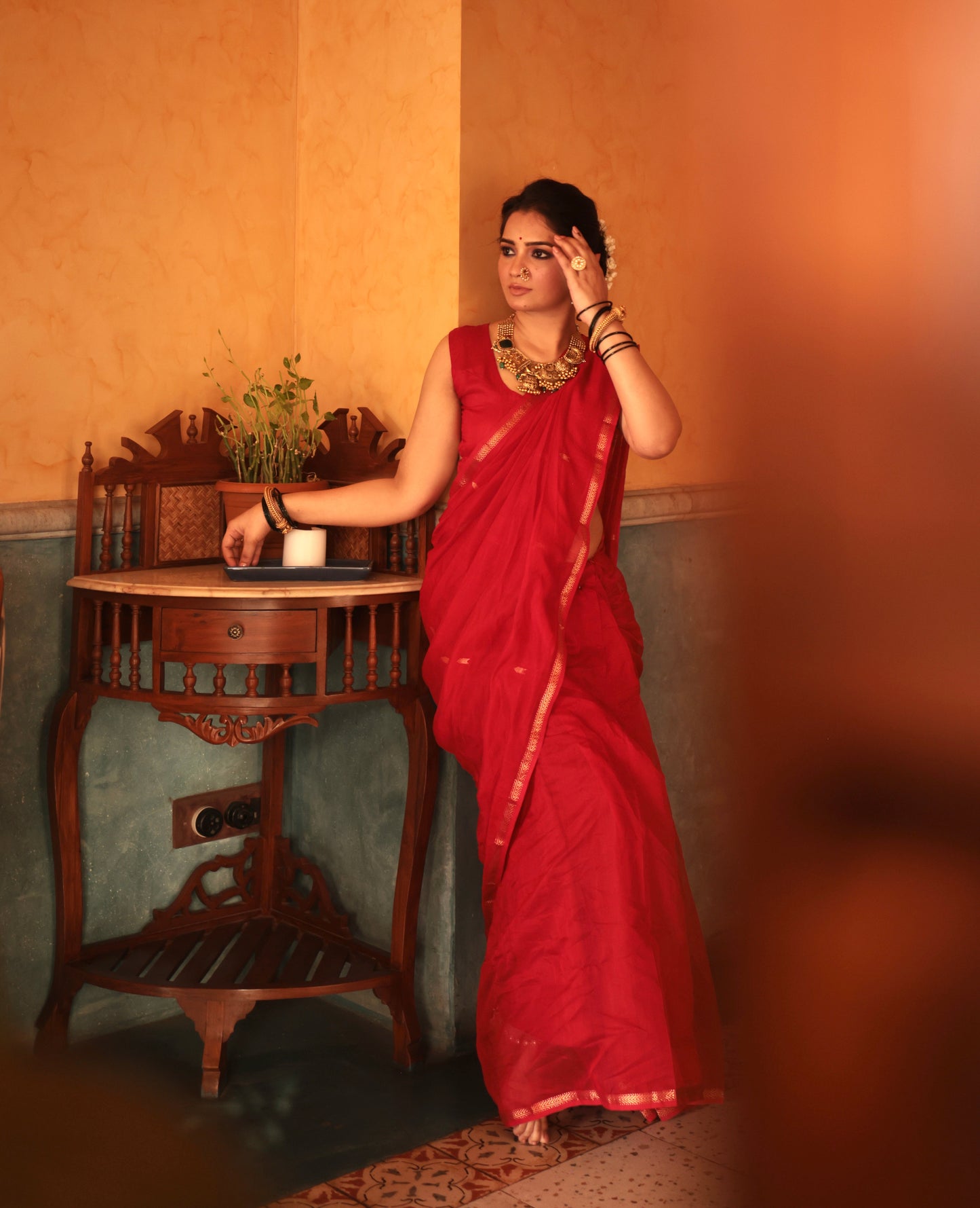 Red maheshwari saree with zari border & zari bootis all over