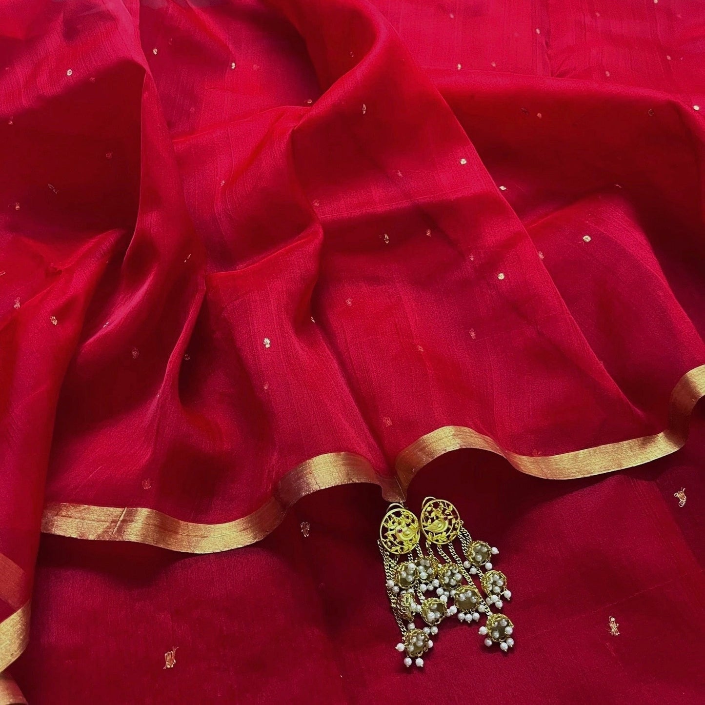 Deep red chanderi organza silk saree with zari bootis all over