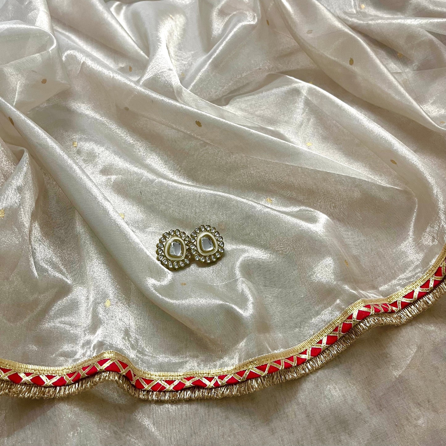 Chantilly cream and red Chanderi tissue silk saree with zari bootis all over