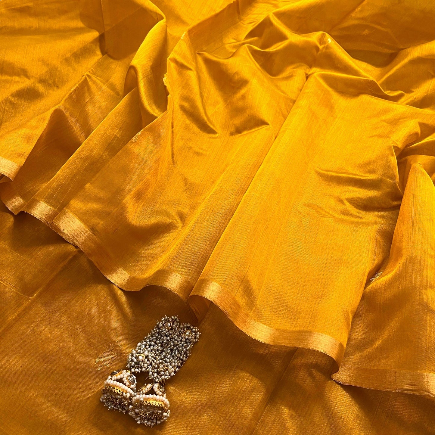 Mustard gold chanderi silk saree with flower bootis all over