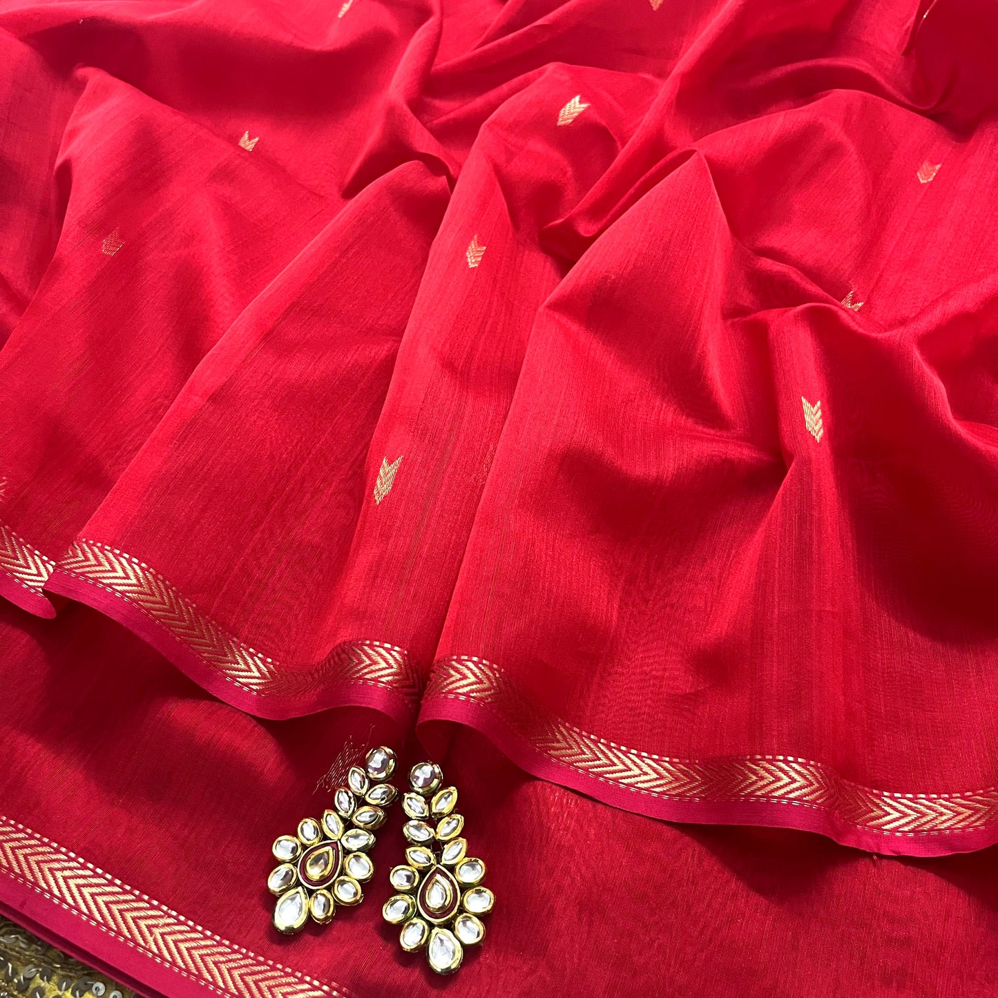 Red maheshwari saree with zari border & zari bootis all over
