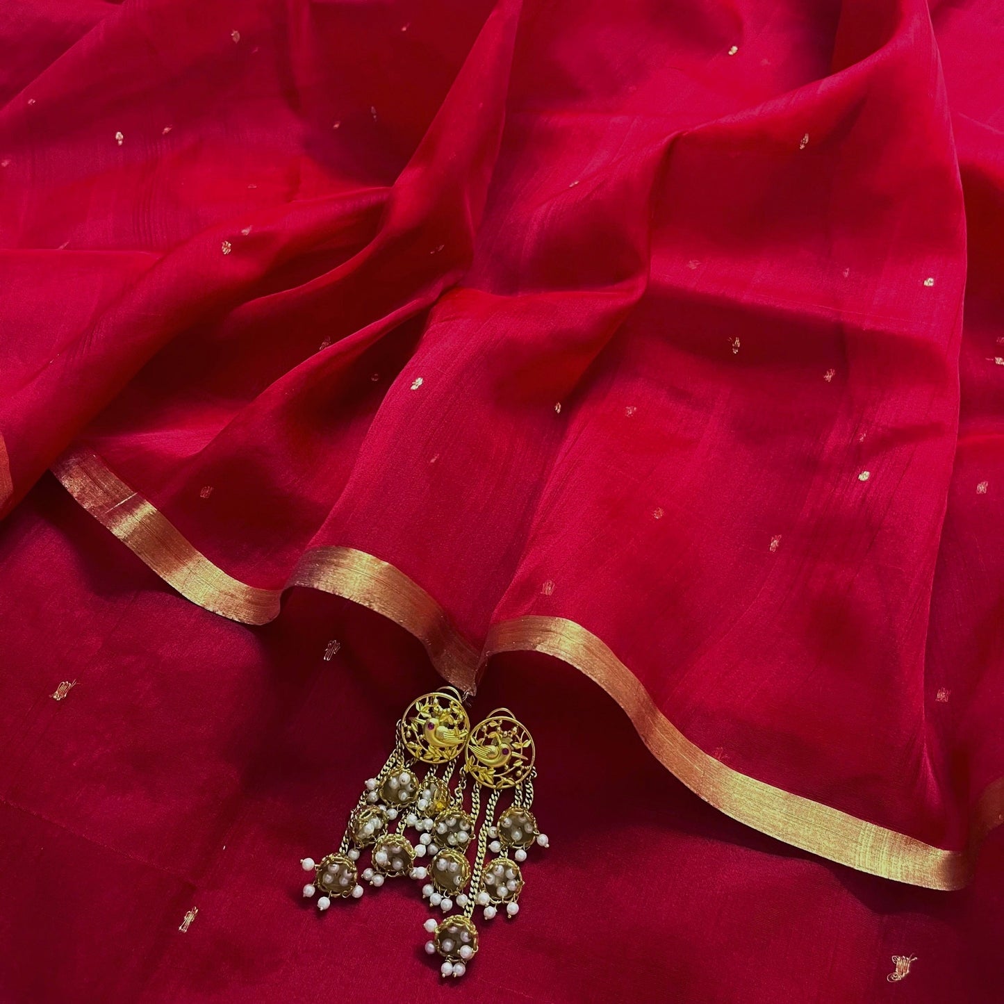 Deep red chanderi organza silk saree with zari bootis all over