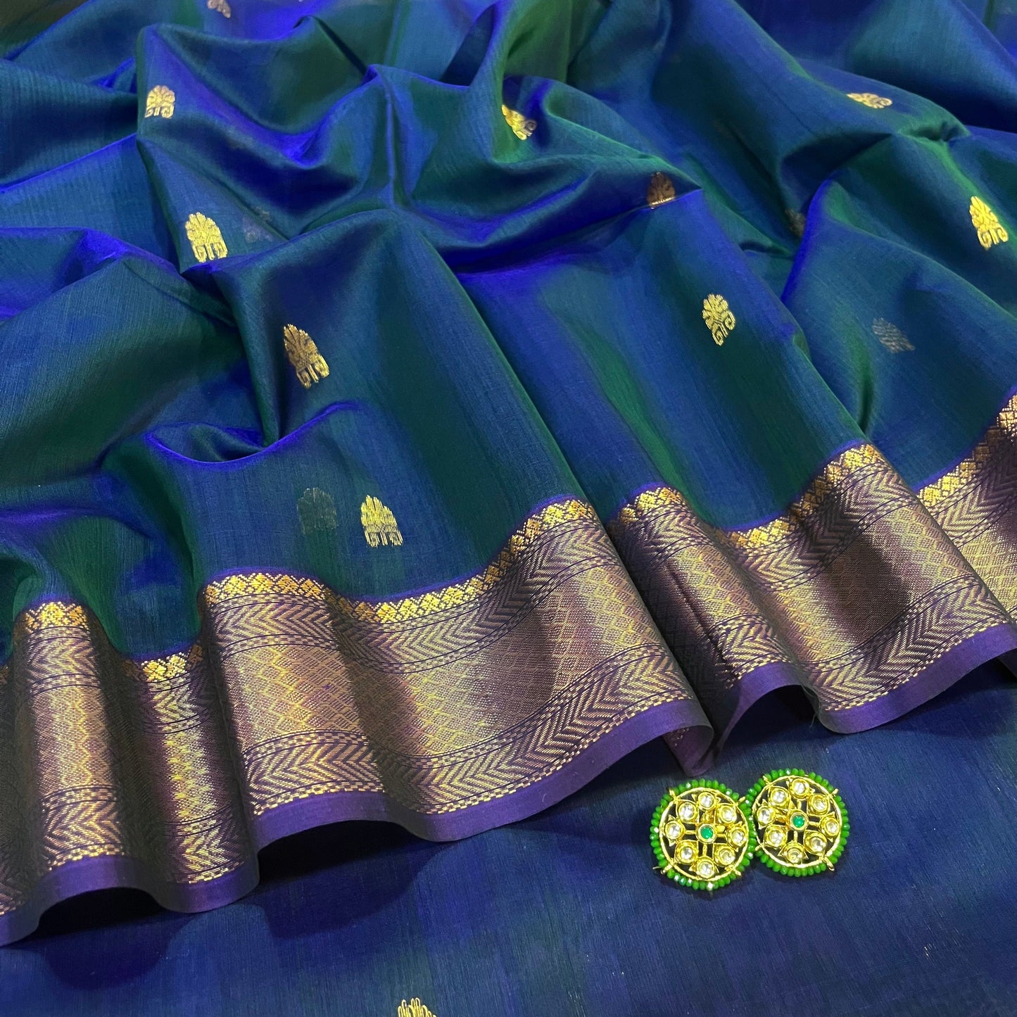 Peacock and purple dual tone Maheshwari saree with zari motifs all over