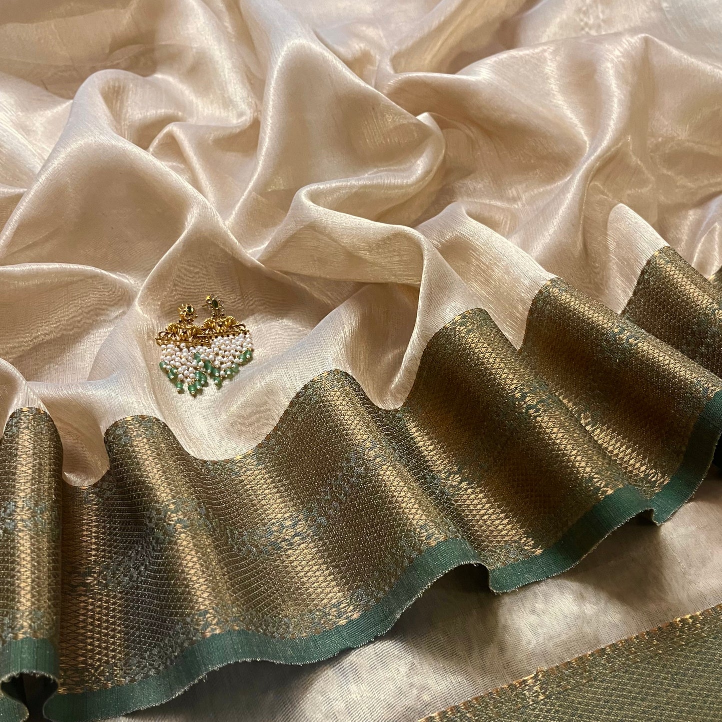 Cream Gold and green Maheshwari tissue silk saree with zari pattern on pallu