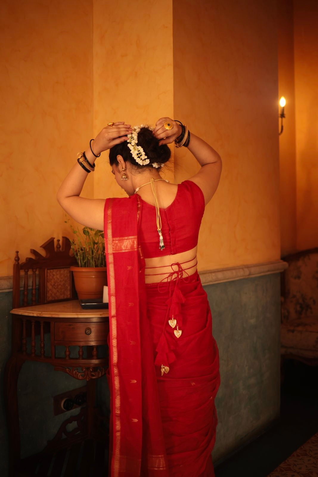 Red maheshwari saree with zari border & zari bootis all over