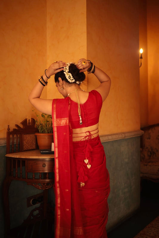 Red maheshwari saree with zari border & zari bootis all over