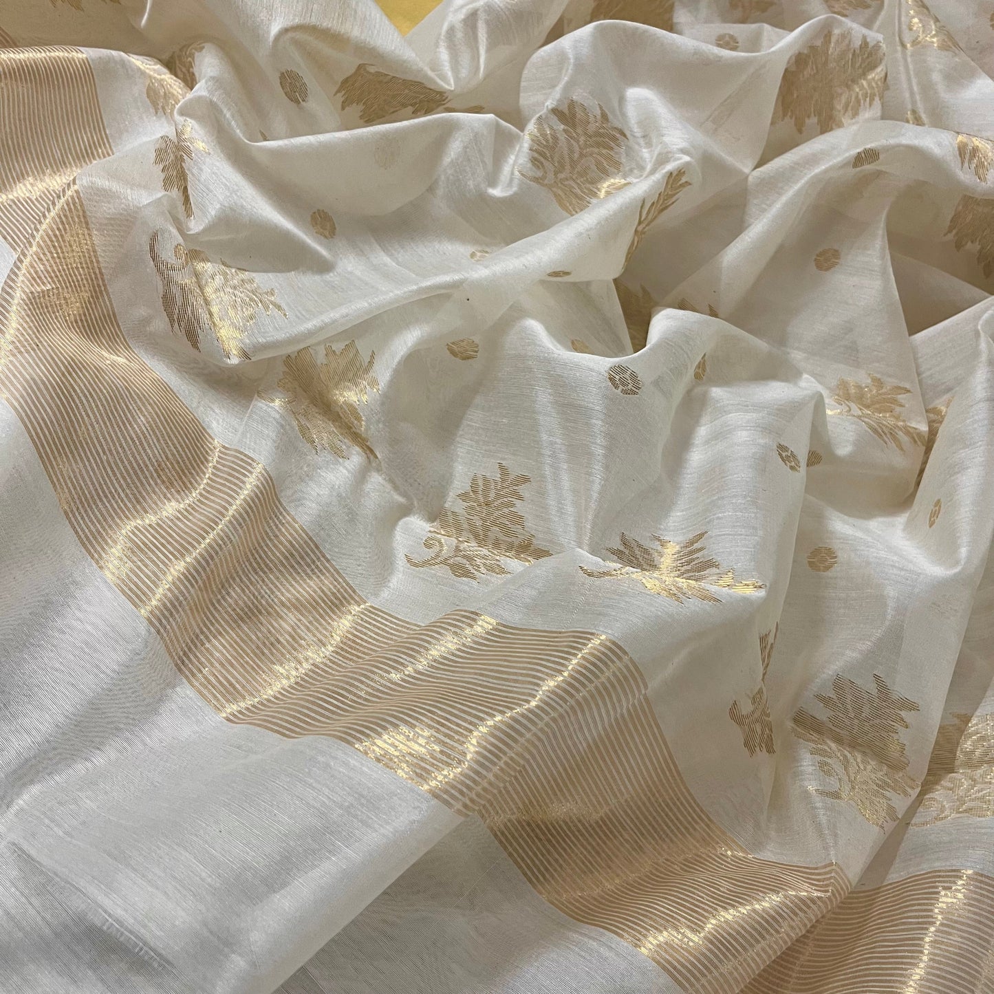 Off white Chanderi saree with zari bootis all over and zari motifs on pallu
