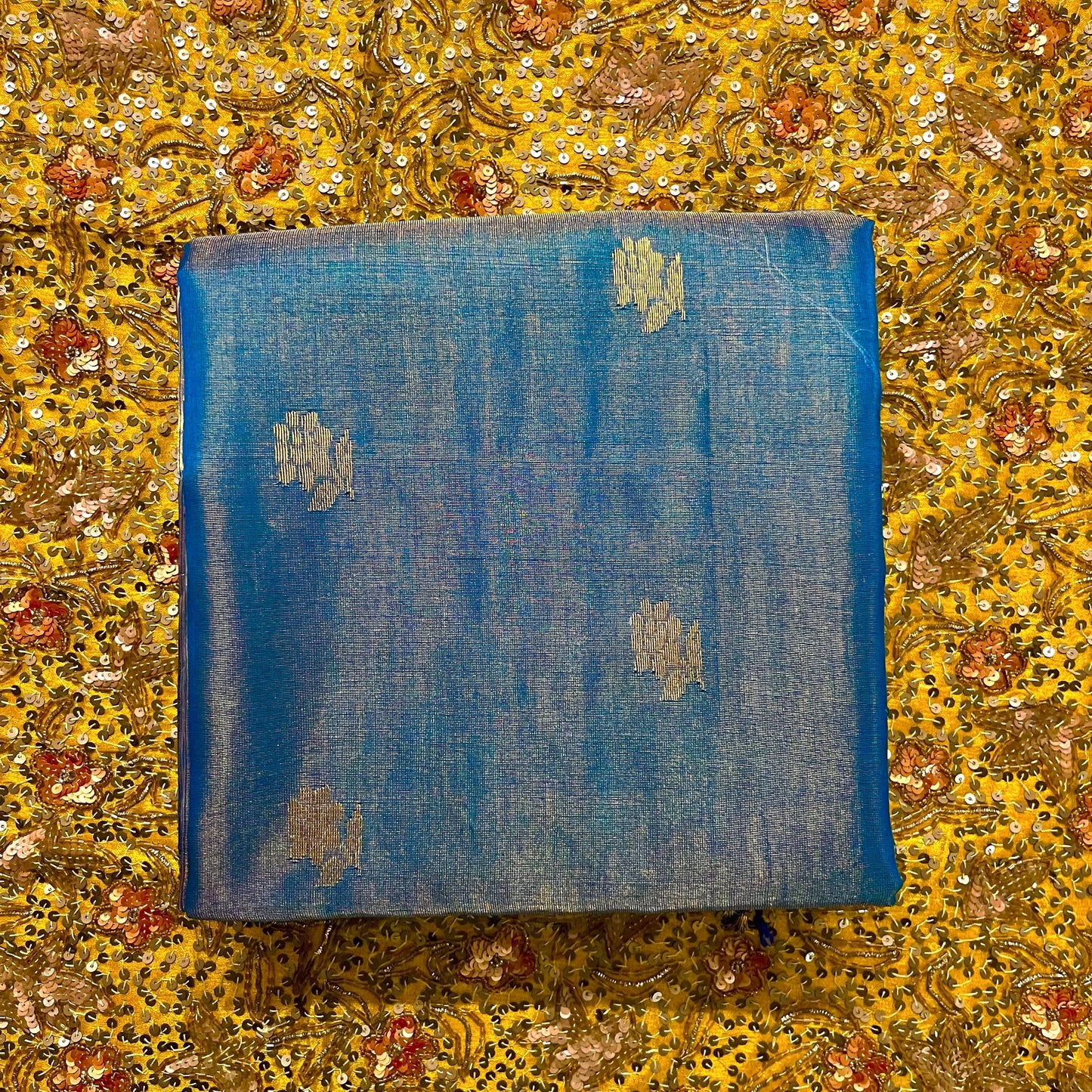 Peacock blue maheshwari tissue silk saree with flower motifs all over