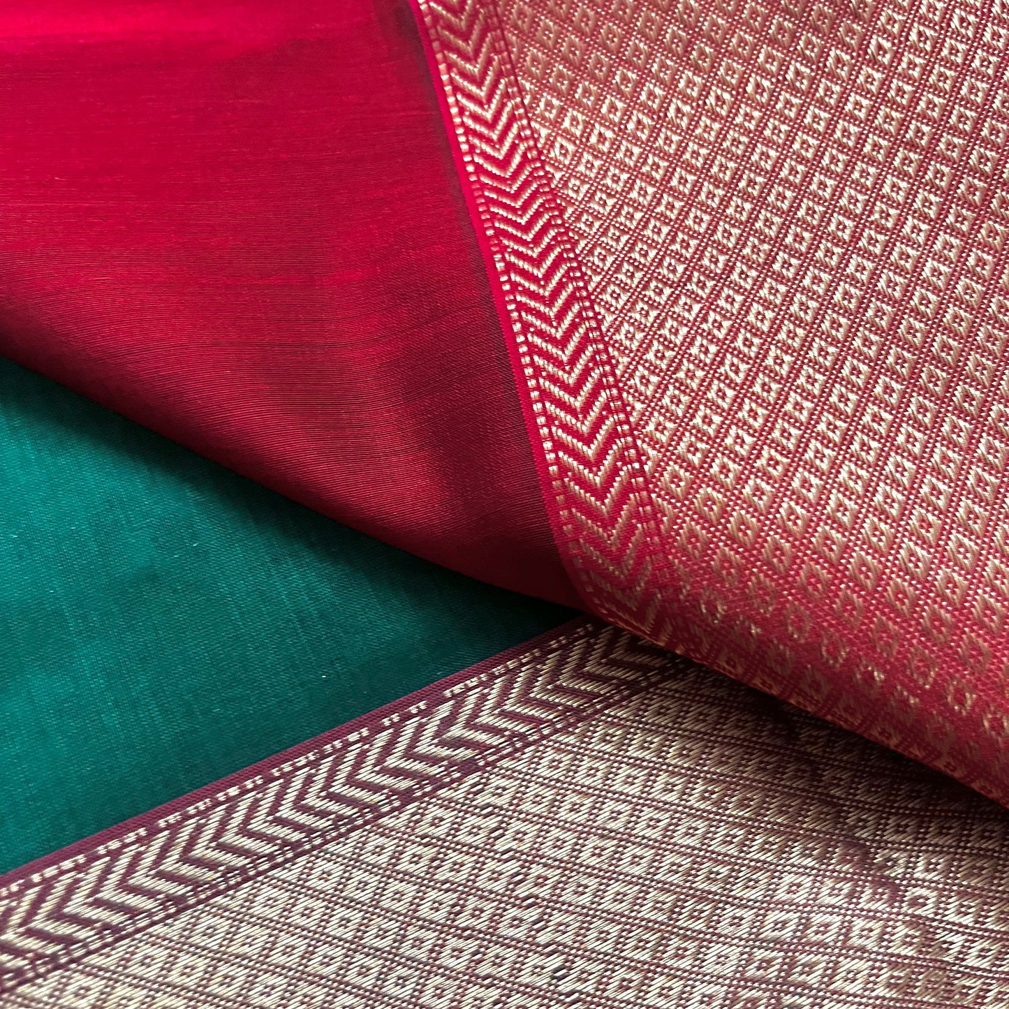 Dark green and red Maheshwari saree with flower motifs all over