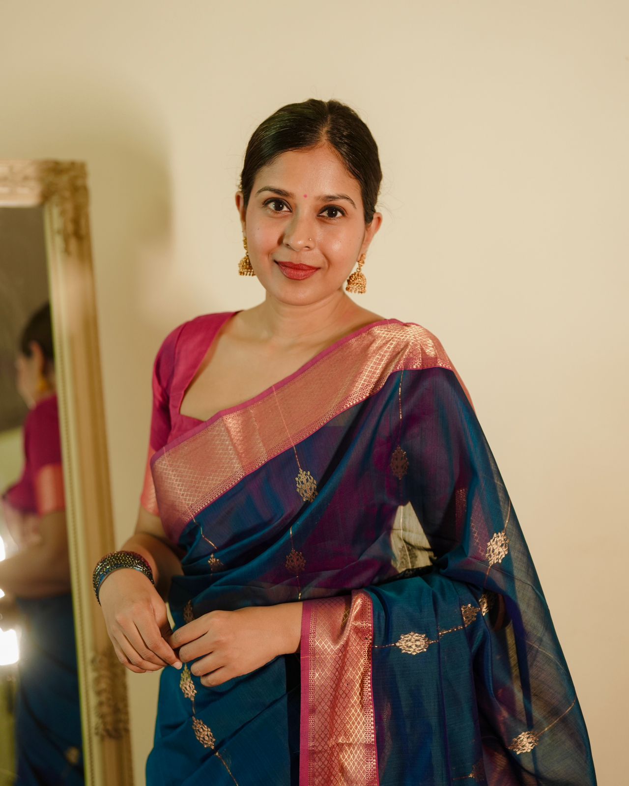 Peacock blue and pink Maheshwari saree with zari motifs all over