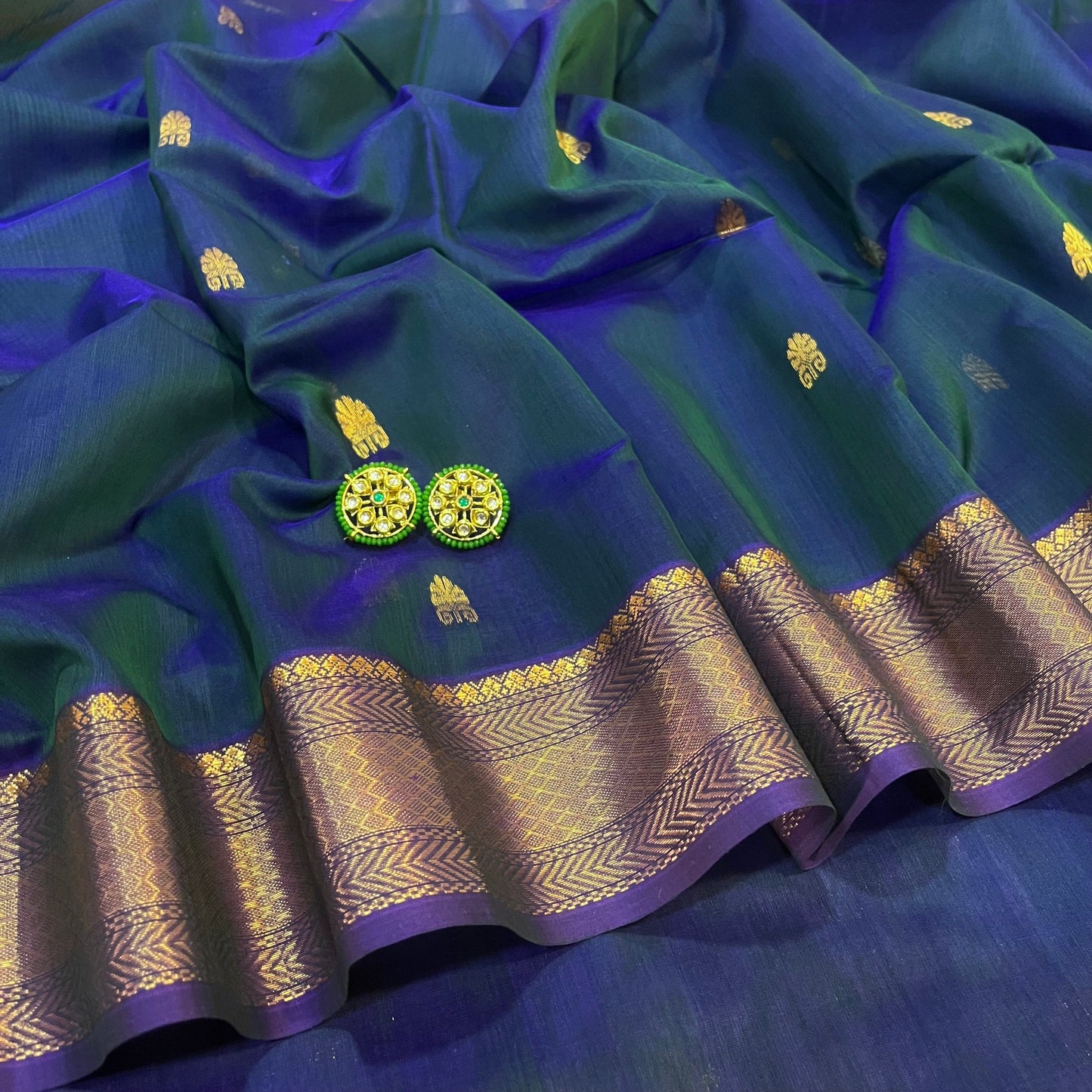 Peacock and purple dual tone Maheshwari saree with zari motifs all over