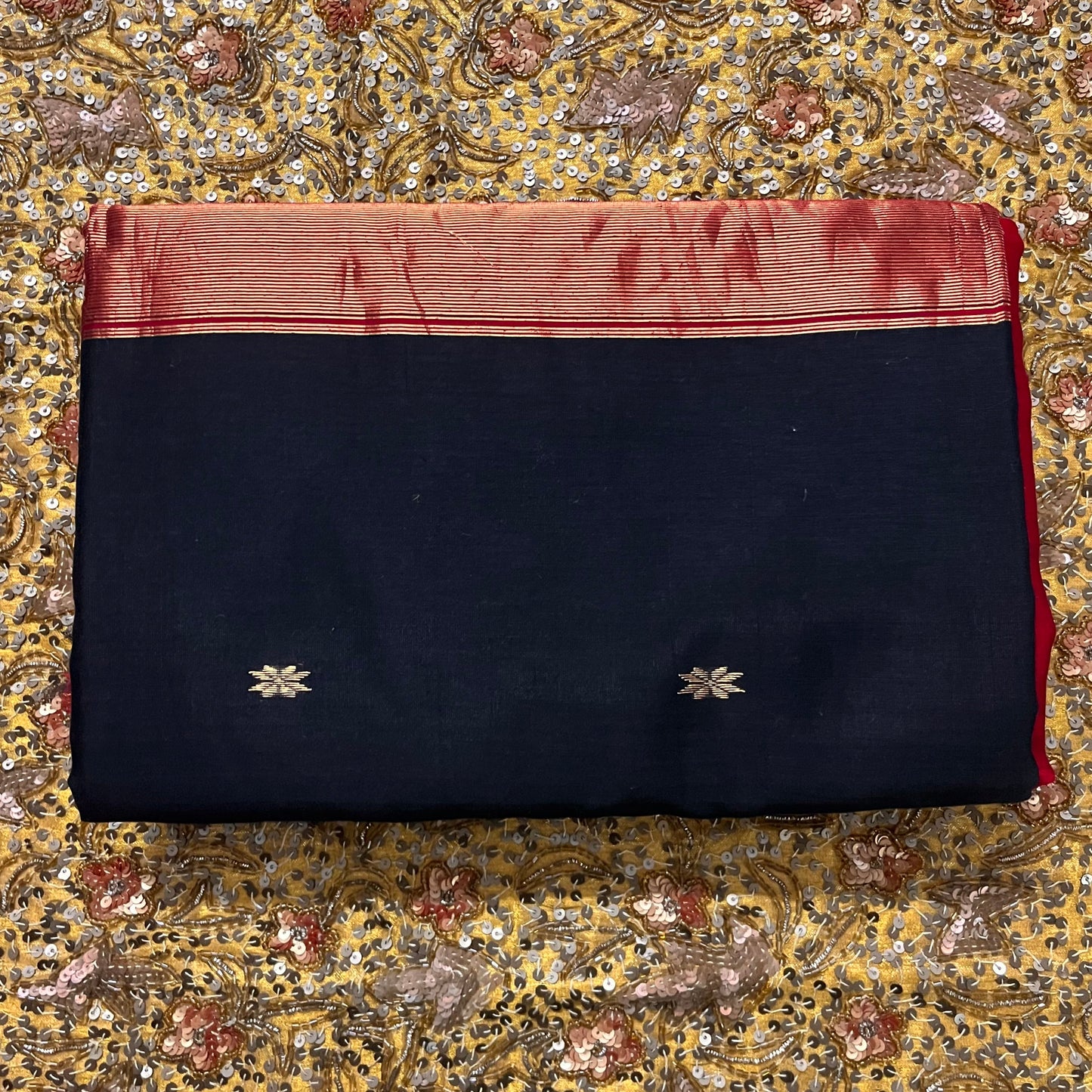Black and maroon Maheshwari saree with flower bootis all over