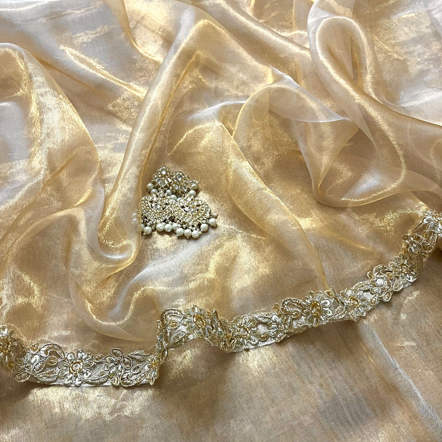 Molten gold chanderi tissue silk saree with intricate work border