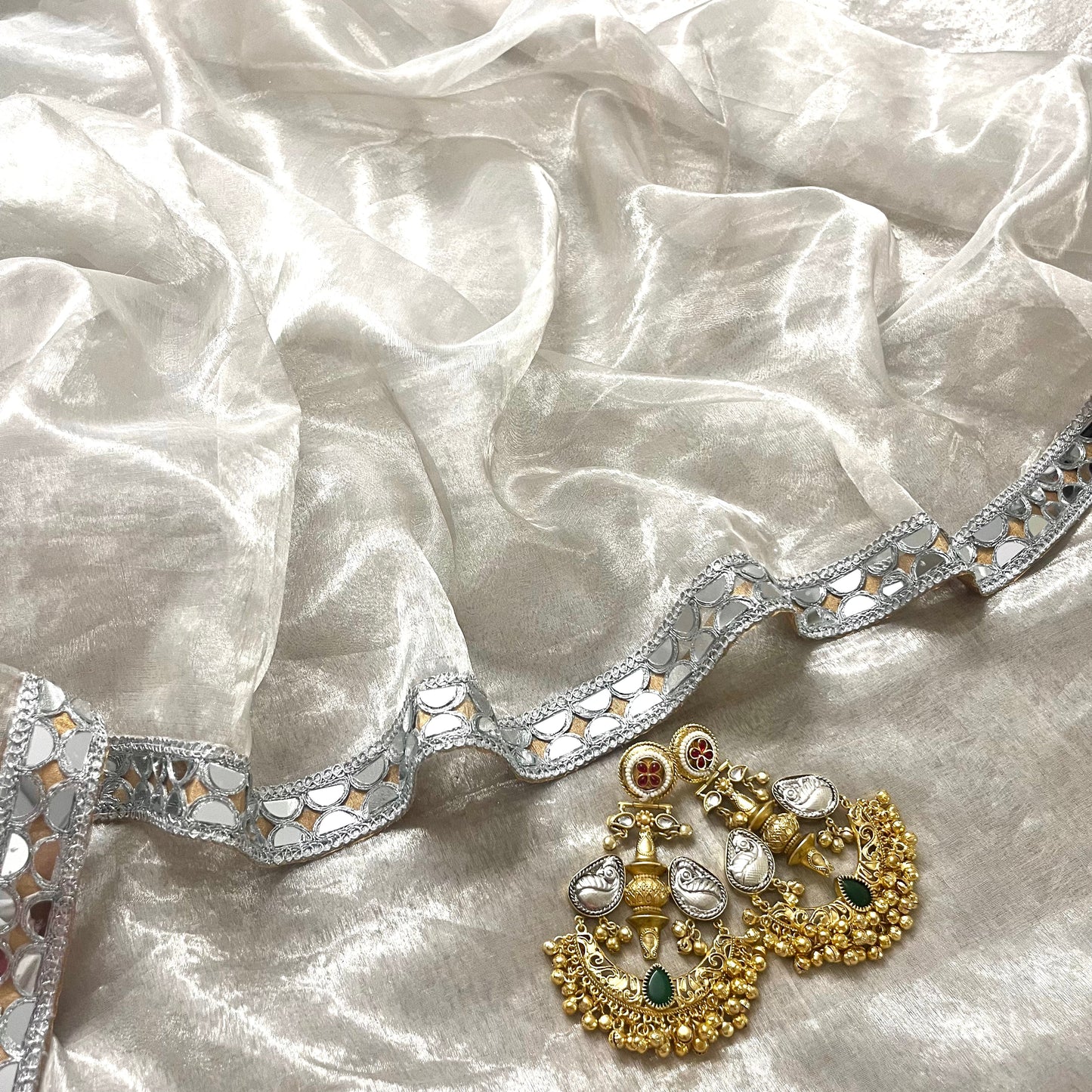 Molten silver and gold chanderi tissue silk saree with mirror work border