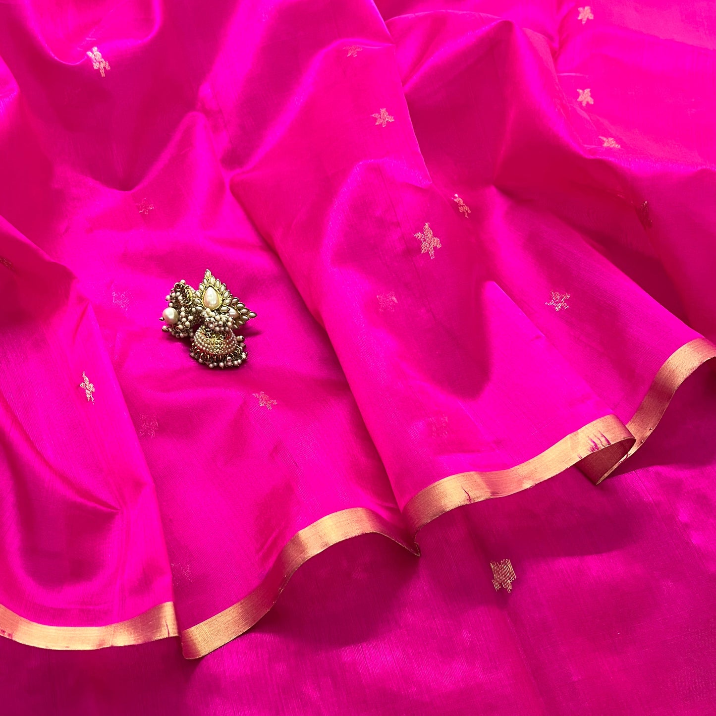 Rani pink chanderi silk saree with flower bootis all over