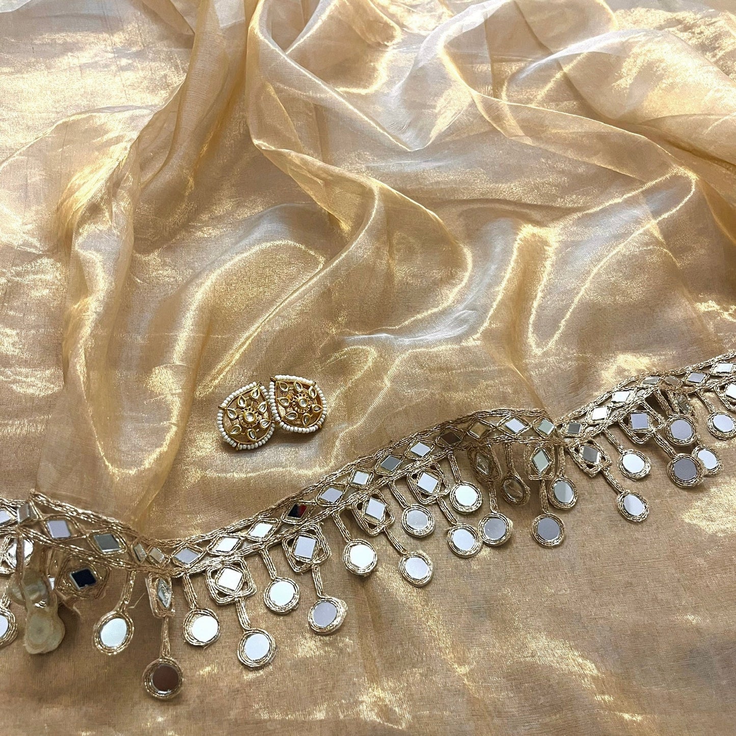 Molten gold chanderi tissue silk saree with dangling mirror work border