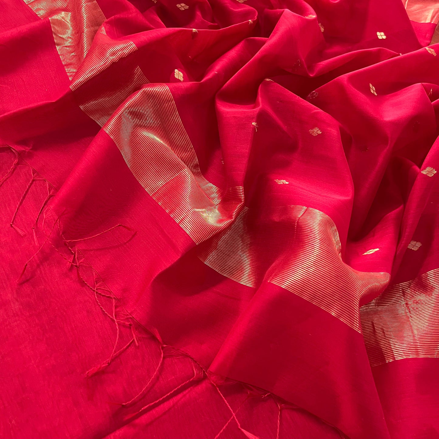 Deep red maheshwari saree with zari bootis all over